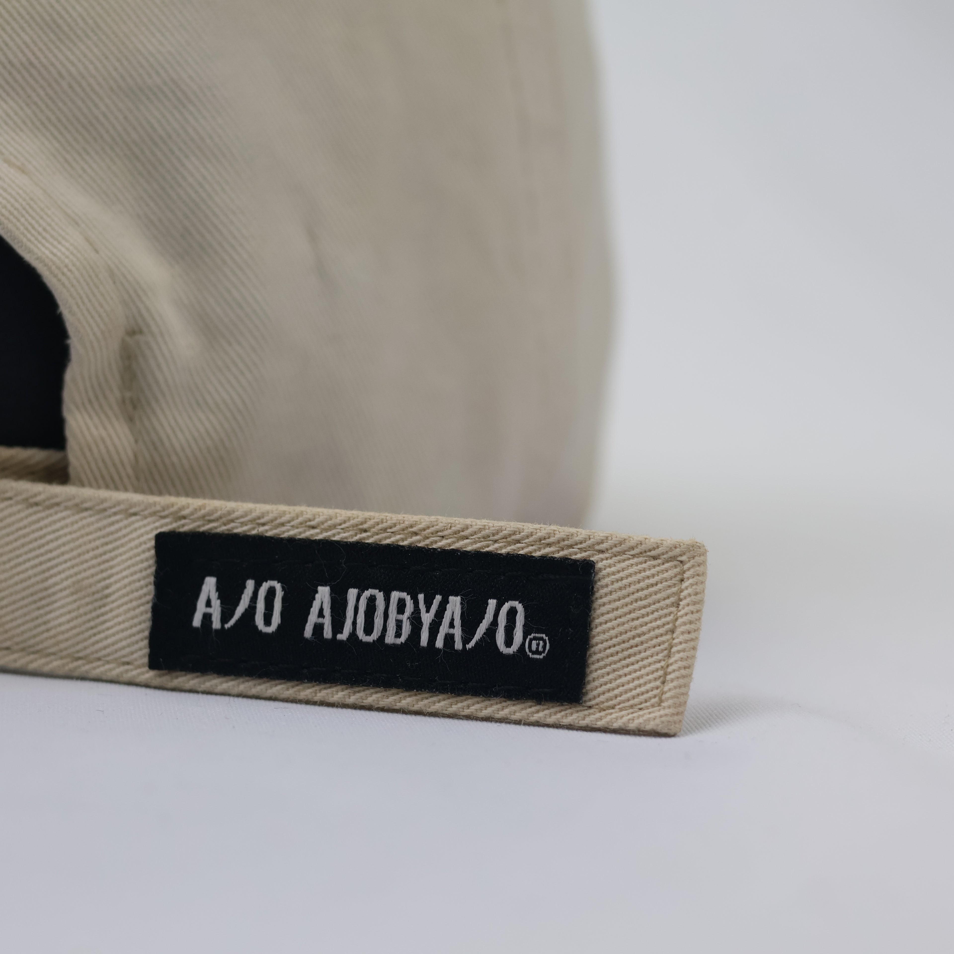 Authentic AJOBYAJO Long-Strap Thrifted Baseball Hat – Cream/Khaki