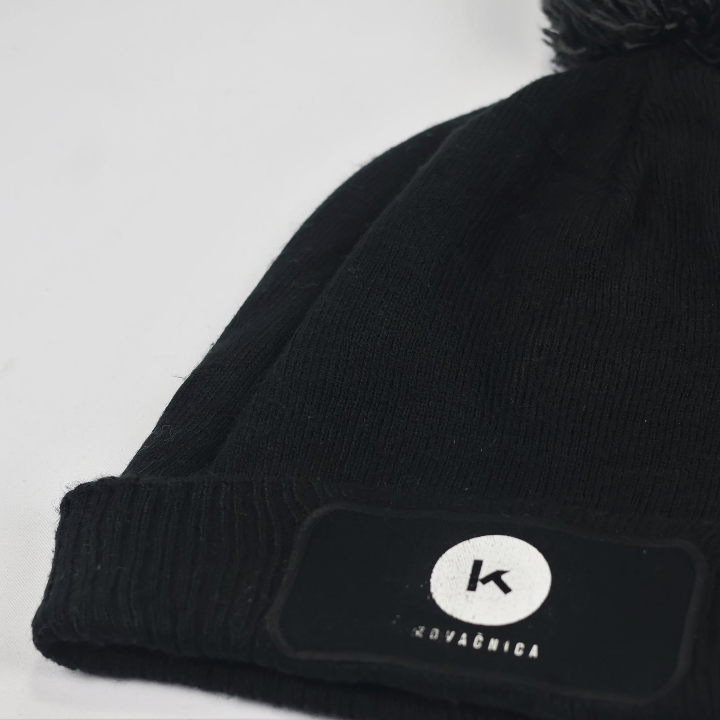Beechfield Black Knit Beanie with Pom Pom & Kovačnica Logo Patch