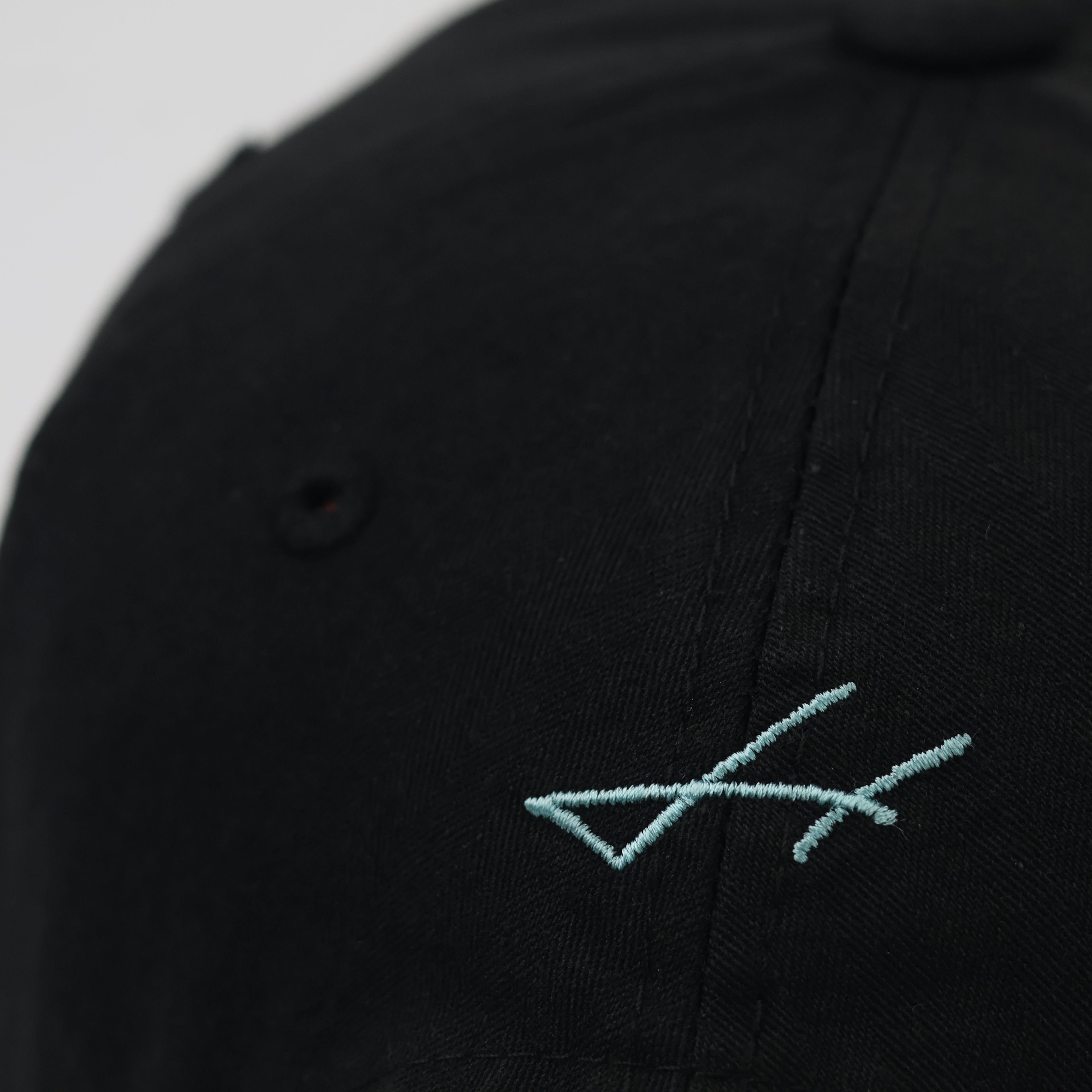 Minimalist Black Thrifted Dad Hat with Teal Cursive Embroidery
