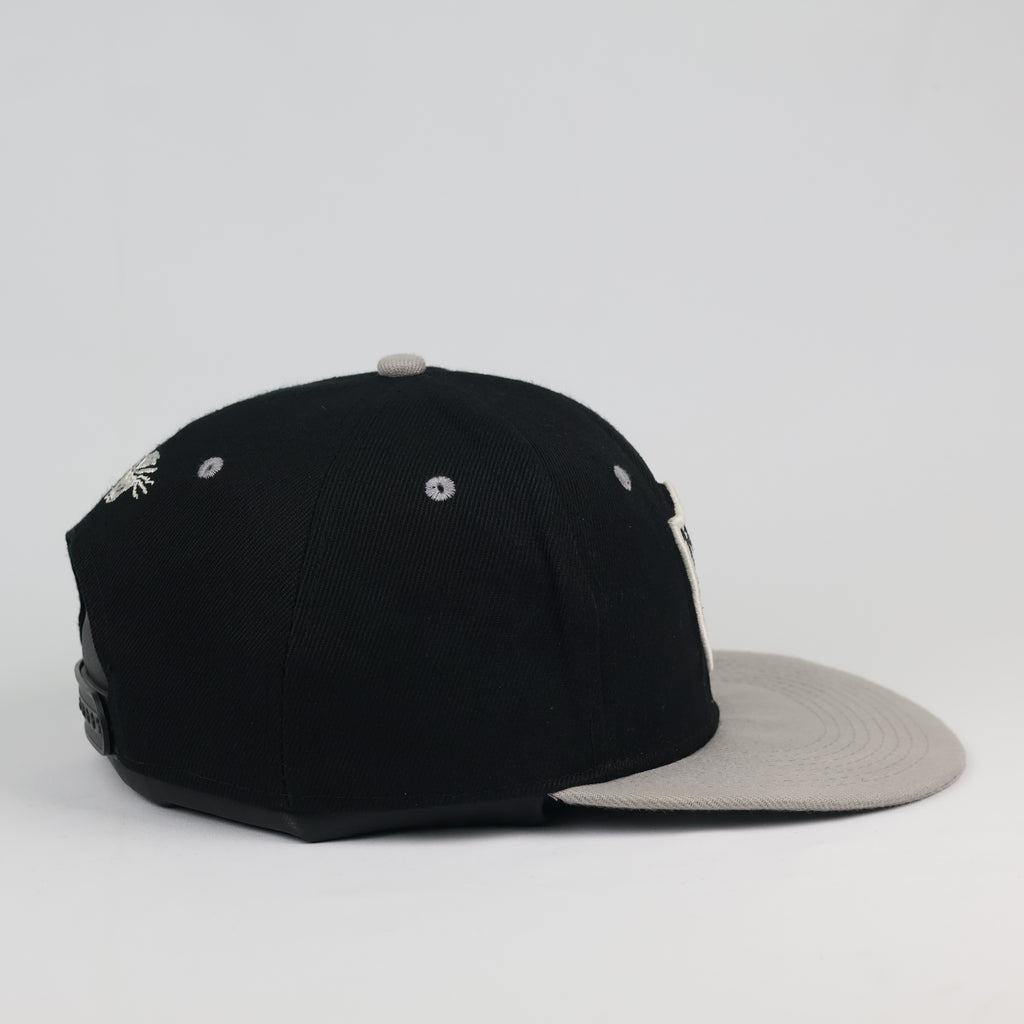 Vintage Raiders Snapback Hat | Black & Grey Two-Tone Sportswear Cap