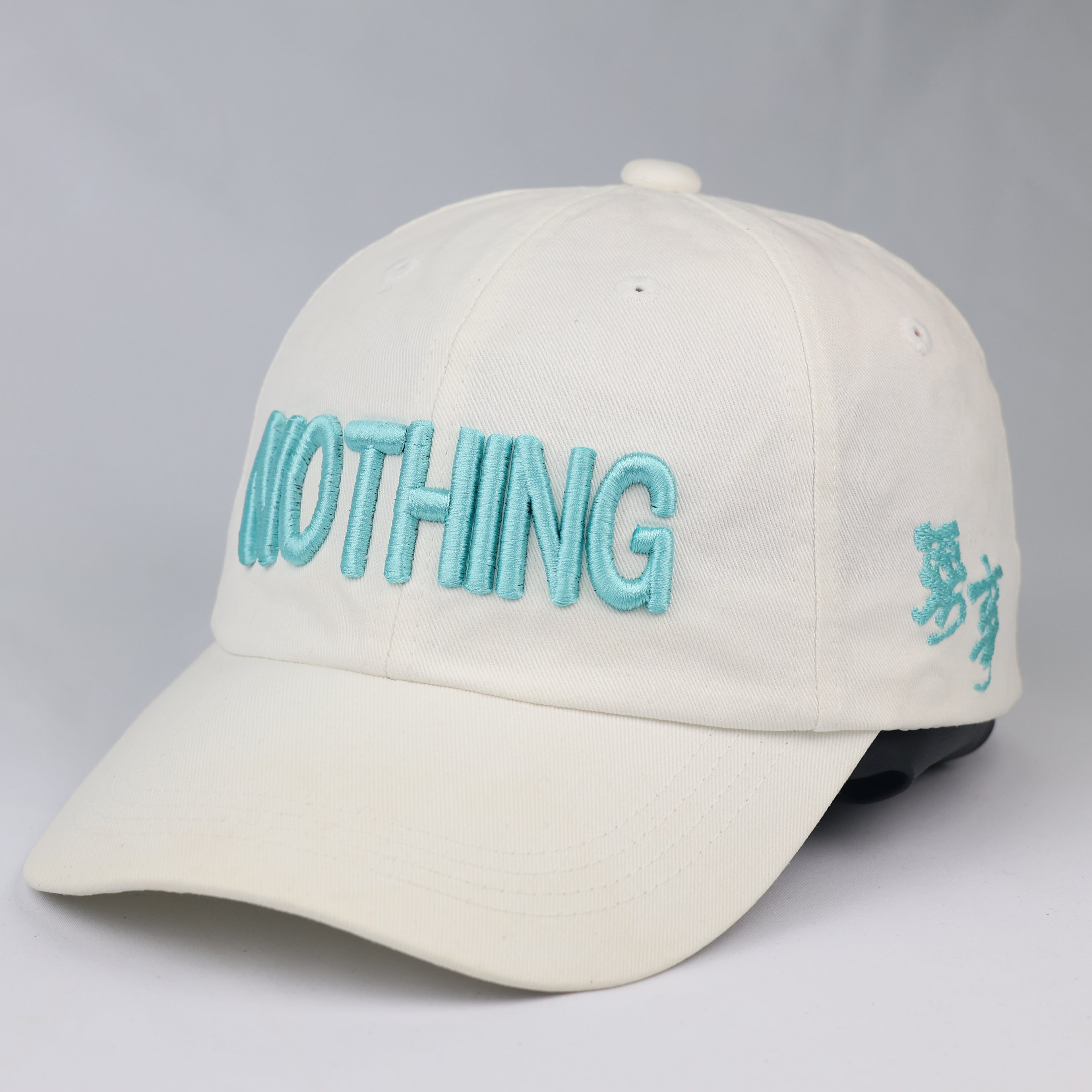 Minimalist "NOTHING" Aesthetic Baseball Cap – Cream & Teal Streetwear