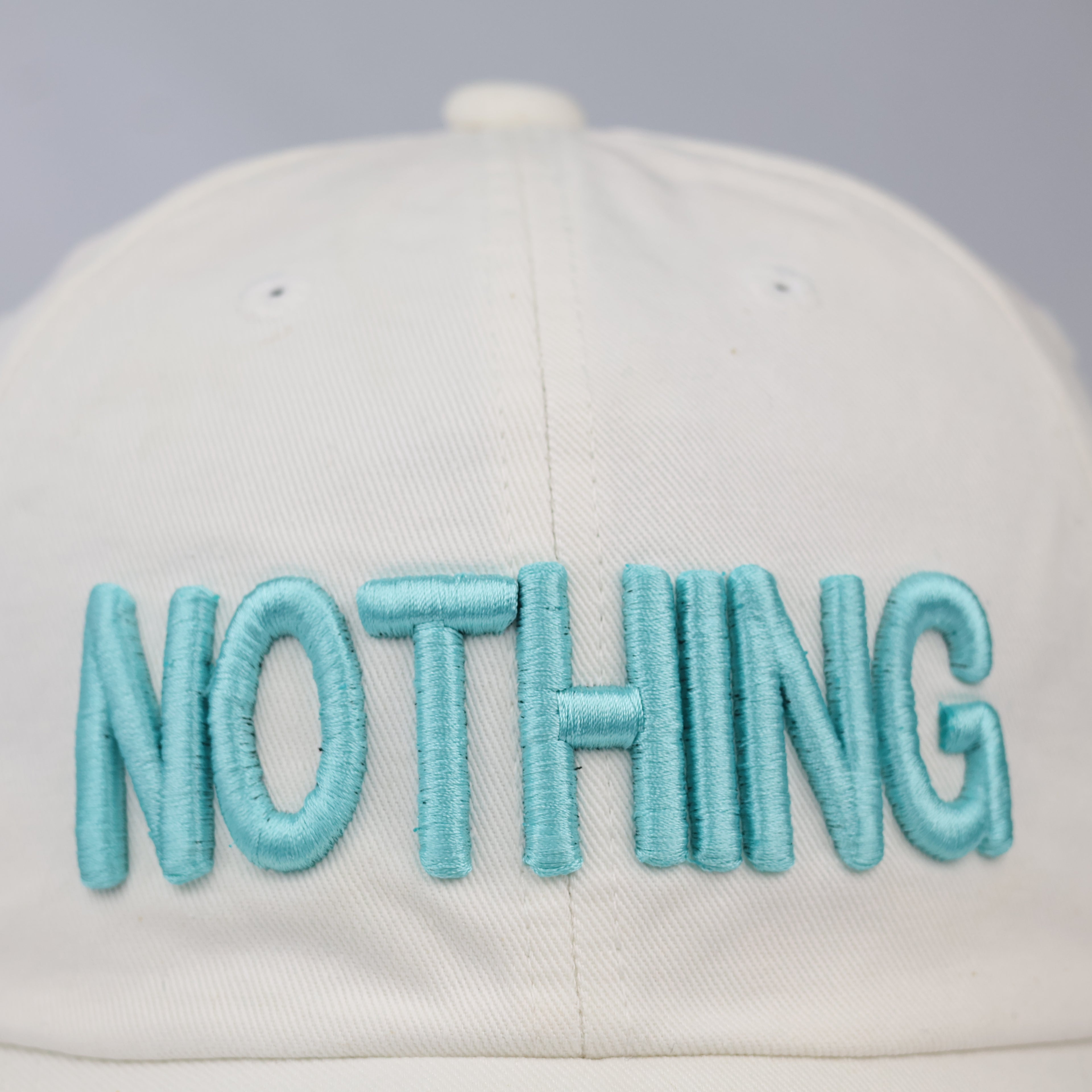 Minimalist "NOTHING" Aesthetic Baseball Cap – Cream & Teal Streetwear