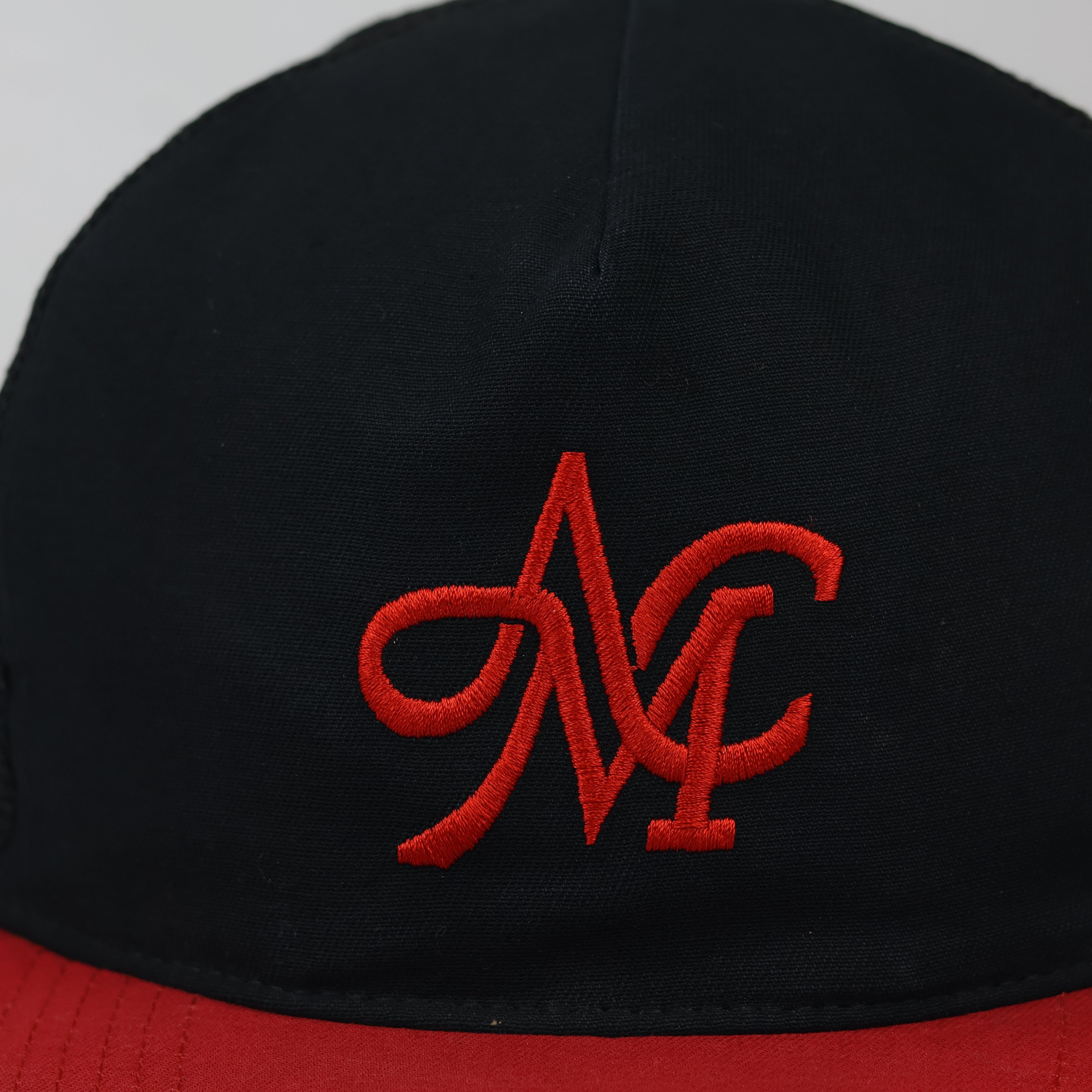 Mania & Co. Embroidered Snapback Trucker Hat - Black/Red Mesh Cap