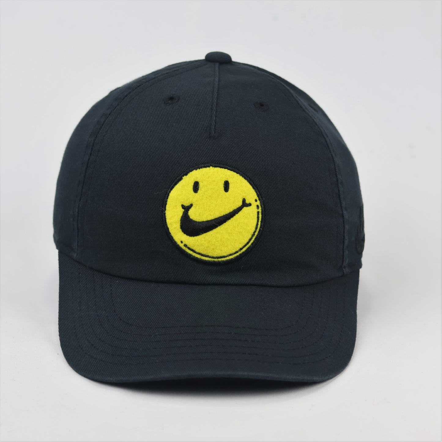 Nike Heritage86 Graphic Thrifted Cap - Black with Yellow Smiley Face Logo